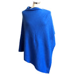 Cobalt colored poncho on dress form